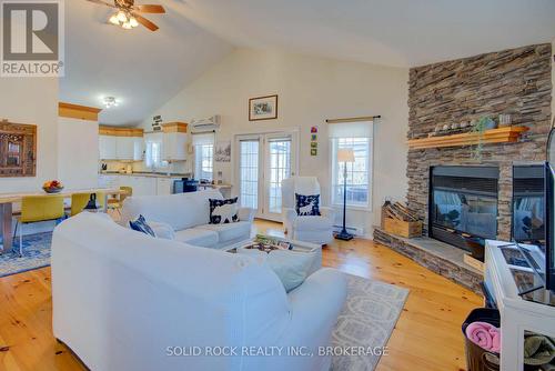 21C Swain Lane, South Frontenac (Frontenac South), ON - Indoor Photo Showing Living Room With Fireplace