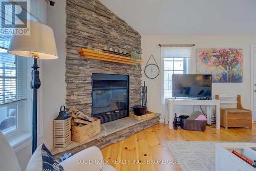 21C Swain Lane, South Frontenac (Frontenac South), ON - Indoor Photo Showing Living Room With Fireplace