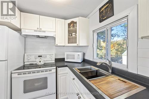 22 - 5569 Bath Road, Loyalist (Lennox And Addington - South), ON - Indoor Photo Showing Kitchen With Double Sink