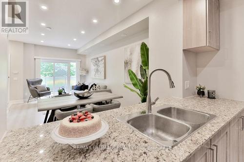 Th06 - 330 Village Green Square, Toronto, ON - Indoor Photo Showing Kitchen With Double Sink