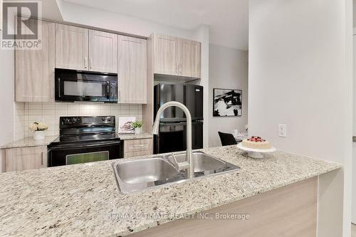 Th06 - 330 Village Green Square, Toronto, ON - Indoor Photo Showing Kitchen With Double Sink