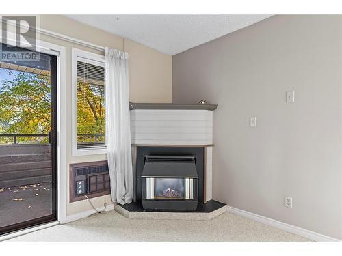 1801 32 Street Unit# 202, Vernon, BC - Indoor Photo Showing Other Room With Fireplace