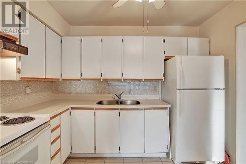 58 Bridgeport Road E Unit# 409, Waterloo, ON - Indoor Photo Showing Kitchen With Double Sink