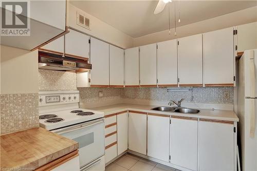 58 Bridgeport Road E Unit# 409, Waterloo, ON - Indoor Photo Showing Kitchen With Double Sink