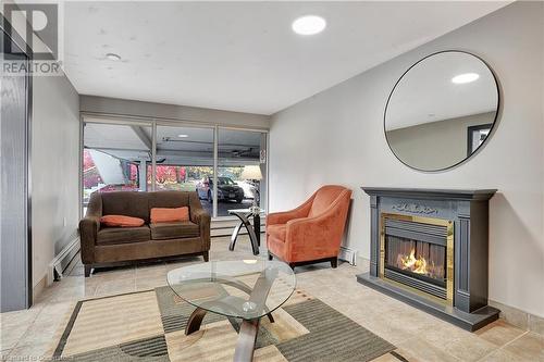 58 Bridgeport Road E Unit# 409, Waterloo, ON - Indoor Photo Showing Living Room With Fireplace