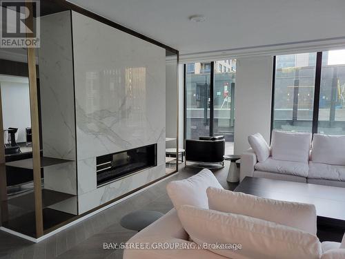 2105 - 77 Shuter Street, Toronto, ON - Indoor Photo Showing Living Room With Fireplace