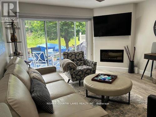 43 - 11 Laguna Parkway, Ramara, ON - Indoor Photo Showing Living Room With Fireplace