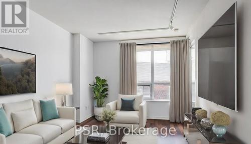 201 - 38 Joe Shuster Way, Toronto, ON - Indoor Photo Showing Living Room