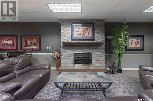 901 1867 Hamilton Street, Regina, SK - Indoor Photo Showing Living Room With Fireplace