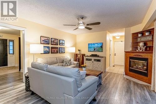 1166 Sunnidale Road, Springwater, ON - Indoor Photo Showing Living Room With Fireplace