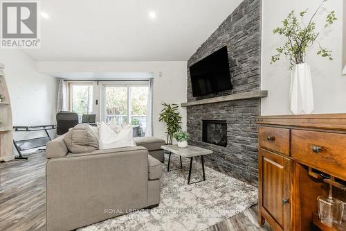 27 - 5 Harbour Street, Collingwood, ON - Indoor Photo Showing Living Room With Fireplace