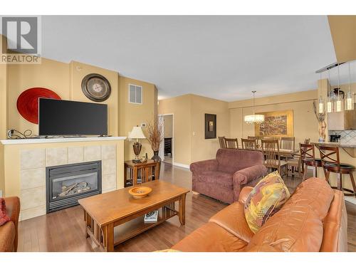 1128 Sunset Drive Unit# 407, Kelowna, BC - Indoor Photo Showing Living Room With Fireplace