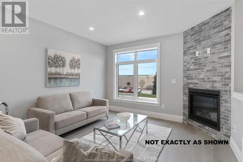 701 Brownstone Drive, Lakeshore, ON - Indoor Photo Showing Living Room With Fireplace