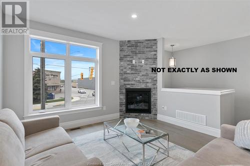 701 Brownstone Drive, Lakeshore, ON - Indoor Photo Showing Living Room With Fireplace