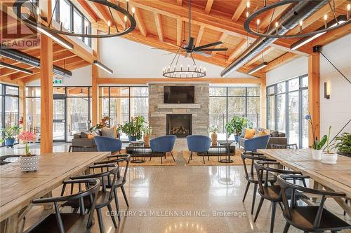 120 Sycamore Street, Blue Mountains, ON - Indoor Photo Showing Dining Room With Fireplace