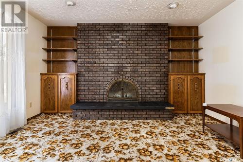 62 Green Meadow Road, Regina, SK - Indoor Photo Showing Other Room With Fireplace