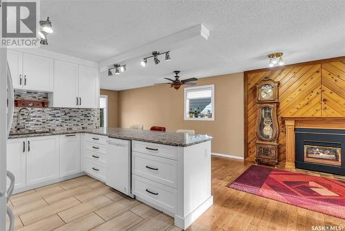 563 Costigan Road, Saskatoon, SK - Indoor Photo Showing Kitchen With Fireplace With Upgraded Kitchen