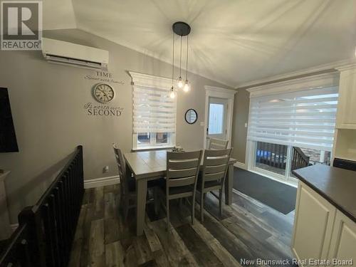 43 Highland Drive, Tide Head, NB - Indoor Photo Showing Dining Room With Fireplace