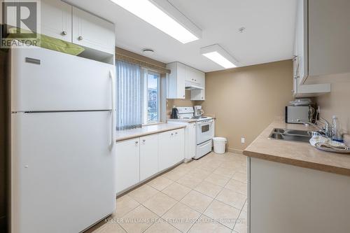 105 - 645 St David Street S, Centre Wellington, ON - Indoor Photo Showing Kitchen With Double Sink