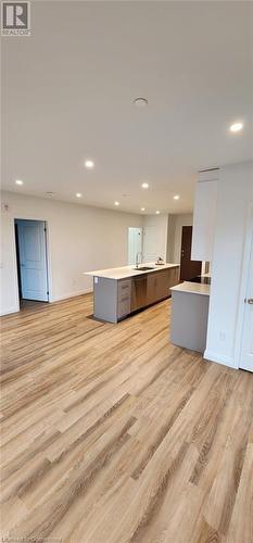 Kitchen with light wood-type flooring and sink - 525 New Dundee Road Unit# 602, Kitchener, ON - Indoor