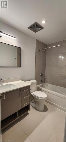 Full bathroom with tile patterned flooring, vanity, tiled shower / bath combo, and toilet - 525 New Dundee Road Unit# 602, Kitchener, ON - Indoor Photo Showing Bathroom