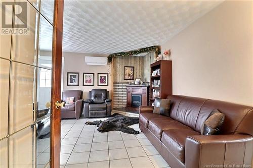 41 Bannister Road, Colpitts Settlement, NB - Indoor Photo Showing Living Room With Fireplace