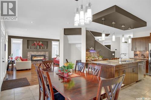 5417 Blake Crescent, Regina, SK - Indoor Photo Showing Dining Room With Fireplace