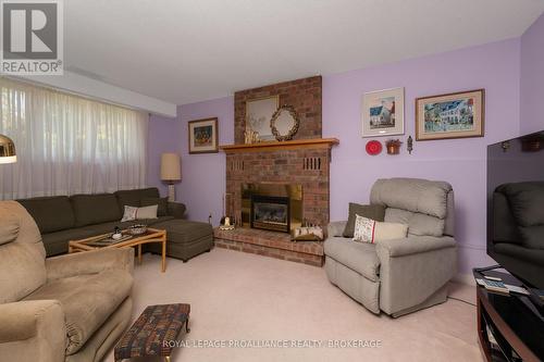 963 Auden Park Drive, Kingston, ON - Indoor Photo Showing Living Room With Fireplace