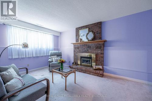 963 Auden Park Drive, Kingston, ON - Indoor Photo Showing Living Room With Fireplace