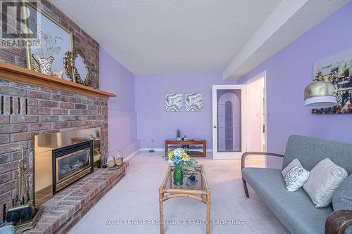 963 Auden Park Drive, Kingston, ON - Indoor Photo Showing Living Room With Fireplace