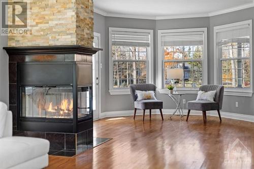 38 Marchvale Drive, Ottawa, ON - Indoor Photo Showing Living Room With Fireplace