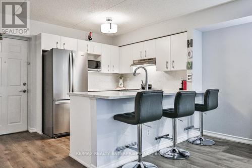 103 - 1460 Bishops Gate, Oakville, ON - Indoor Photo Showing Kitchen With Stainless Steel Kitchen With Upgraded Kitchen