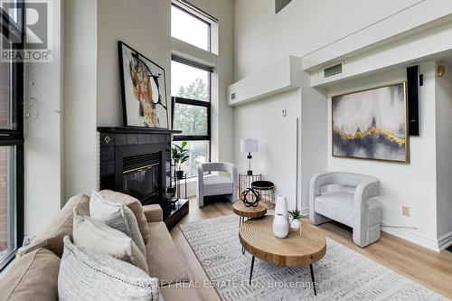 202 - 393 King Street E, Toronto, ON - Indoor Photo Showing Living Room With Fireplace