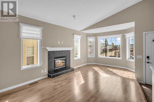 150 Lakeview Inlet, Chestermere, AB - Indoor Photo Showing Living Room With Fireplace