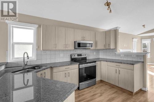 150 Lakeview Inlet, Chestermere, AB - Indoor Photo Showing Kitchen With Double Sink With Upgraded Kitchen