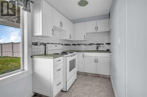 150 Lakeview Inlet, Chestermere, AB - Indoor Photo Showing Kitchen With Double Sink