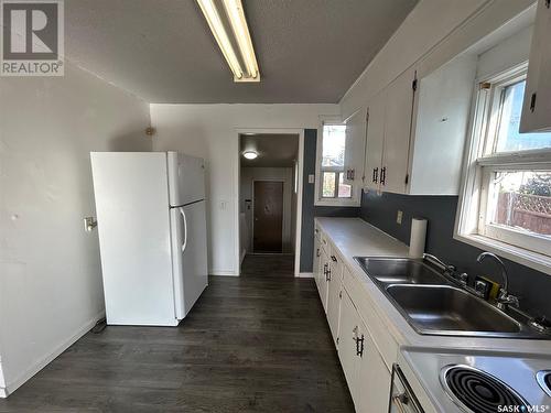 155 Broad Street, Regina, SK - Indoor Photo Showing Kitchen With Double Sink