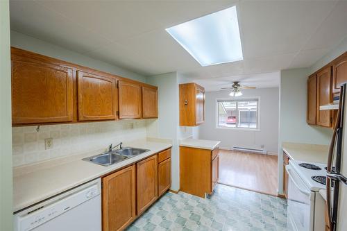 106-1860 Atkinson Street, Penticton, BC - Indoor Photo Showing Kitchen With Double Sink