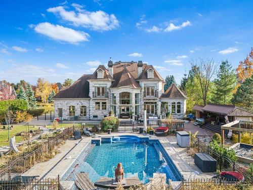 Back facade - 750 Rue Des Châtaigniers, Boucherville, QC - Outdoor With In Ground Pool