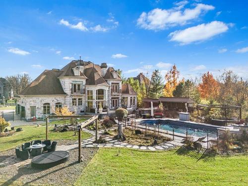 Back facade - 750 Rue Des Châtaigniers, Boucherville, QC - Outdoor With In Ground Pool