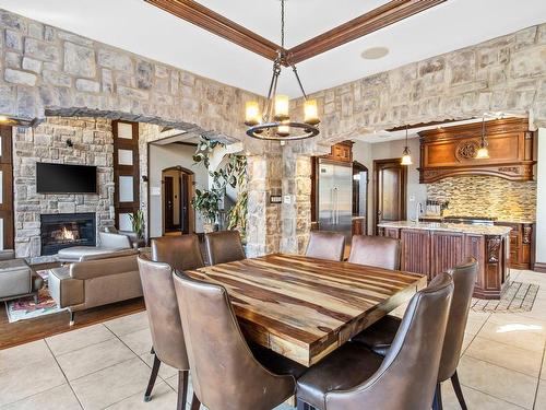 Dinette - 750 Rue Des Châtaigniers, Boucherville, QC - Indoor Photo Showing Dining Room With Fireplace