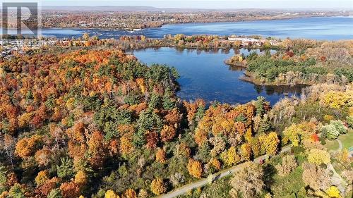 If you’re a nature lover you’re going to love exploring around mud lake. Terrific views and check out the landmark called Big Rock while you’re out roaming the woods. - 2625-501 Regina Street, Ottawa, ON - Outdoor With Body Of Water With View