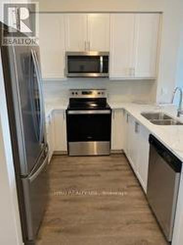 621 - 610 Farmstead Drive, Milton, ON - Indoor Photo Showing Kitchen With Double Sink