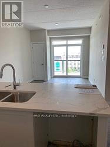 621 - 610 Farmstead Drive, Milton, ON - Indoor Photo Showing Kitchen With Double Sink