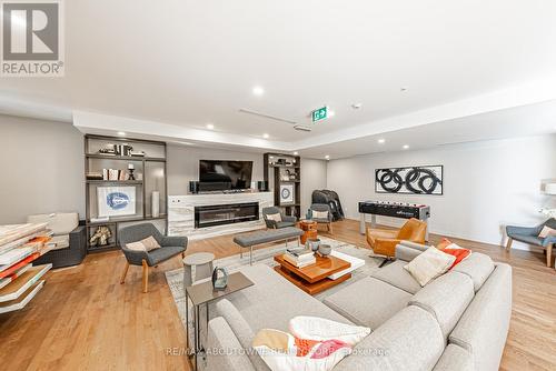 404 - 457 Plains Road E, Burlington, ON - Indoor Photo Showing Living Room With Fireplace