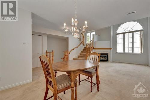 44 Briston Private, Ottawa, ON - Indoor Photo Showing Dining Room With Fireplace