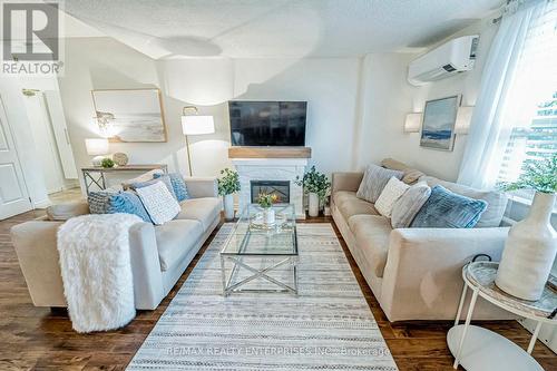 101 - 49 Queen Street E, Mississauga, ON - Indoor Photo Showing Living Room With Fireplace