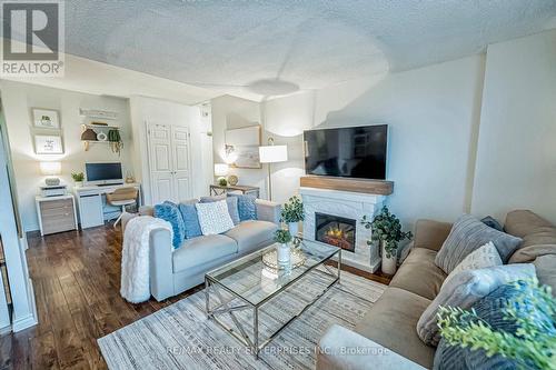 101 - 49 Queen Street E, Mississauga, ON - Indoor Photo Showing Living Room With Fireplace