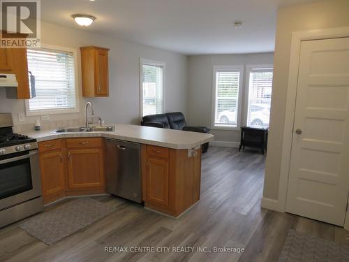 view from kitchen to living room - 116 - 2189 Dundas Street E, London, ON - Indoor Photo Showing Kitchen With Double Sink