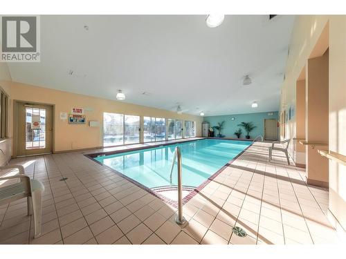 595 Yates Road Unit# 75, Kelowna, BC - Indoor Photo Showing Other Room With In Ground Pool